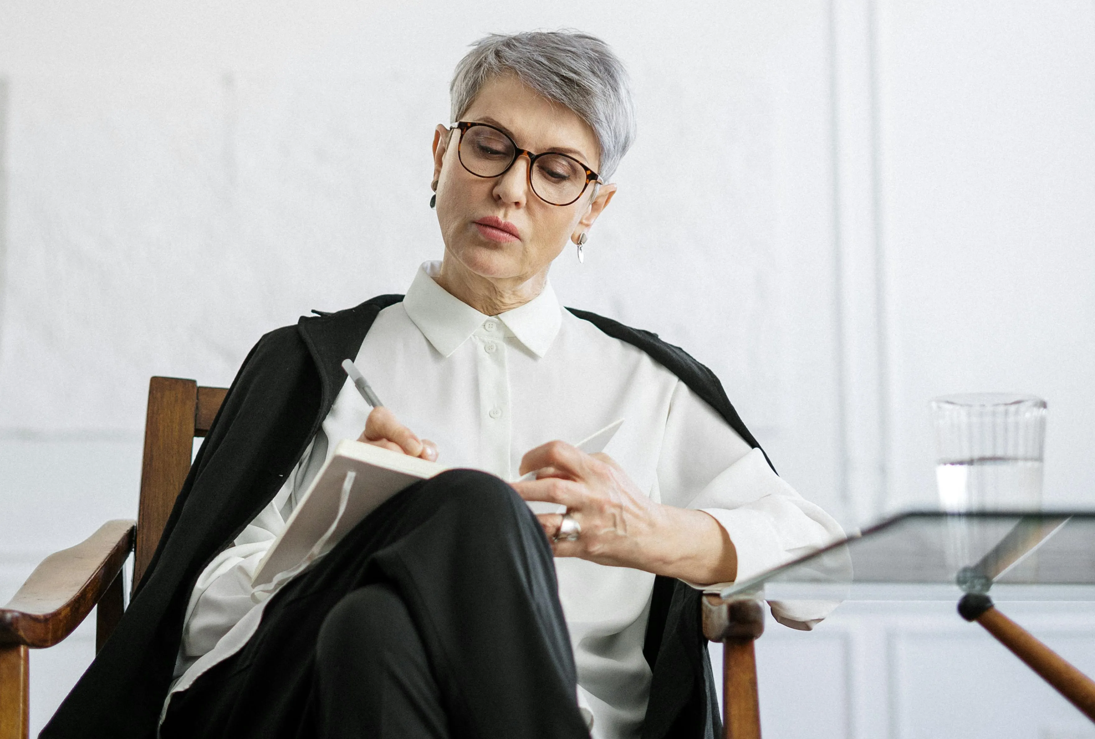 Coach taking notes during consultation