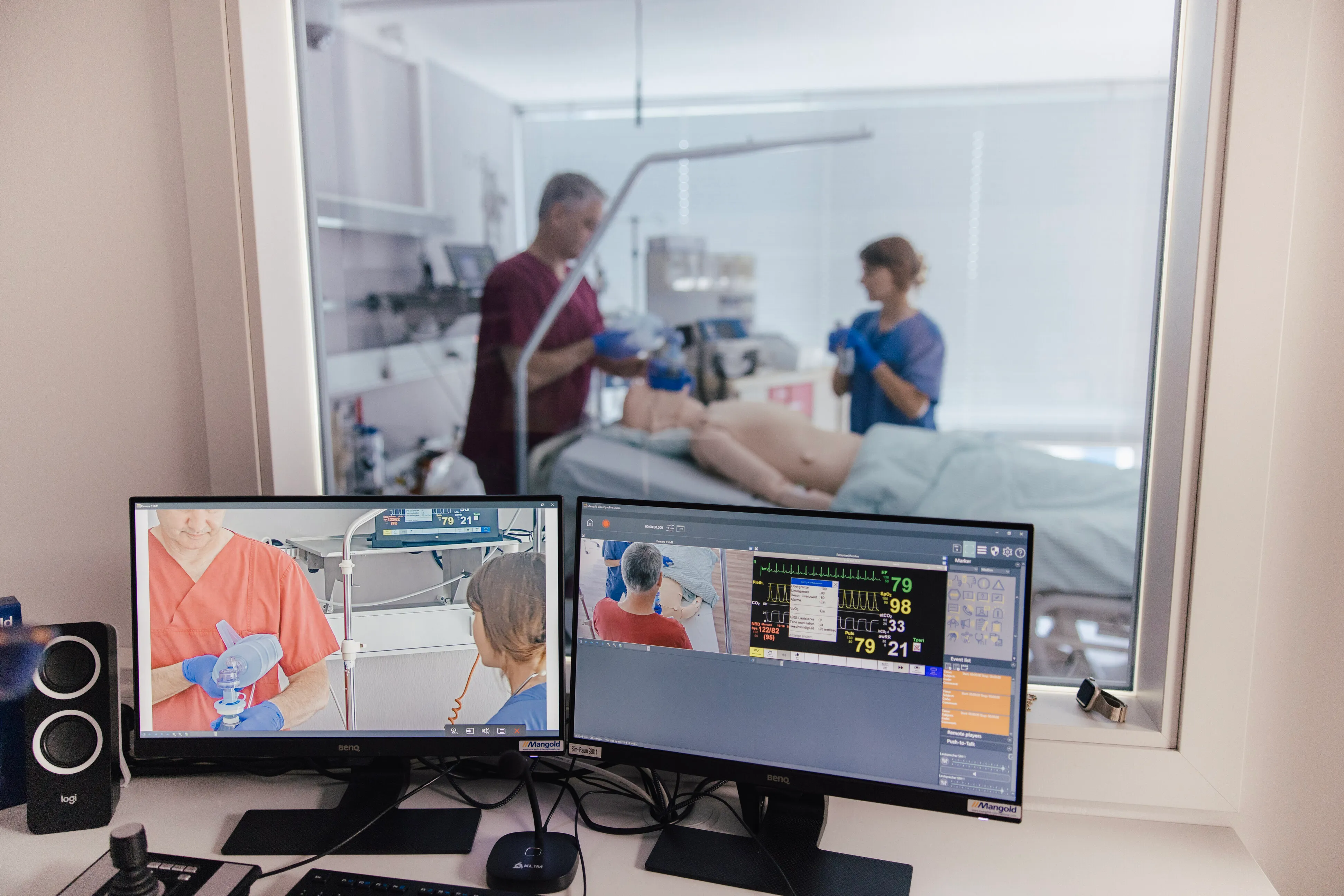 Medical simulation control workstation with multiple monitors