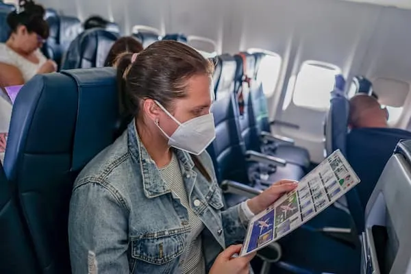 Passenger in aircraft cabin during flight